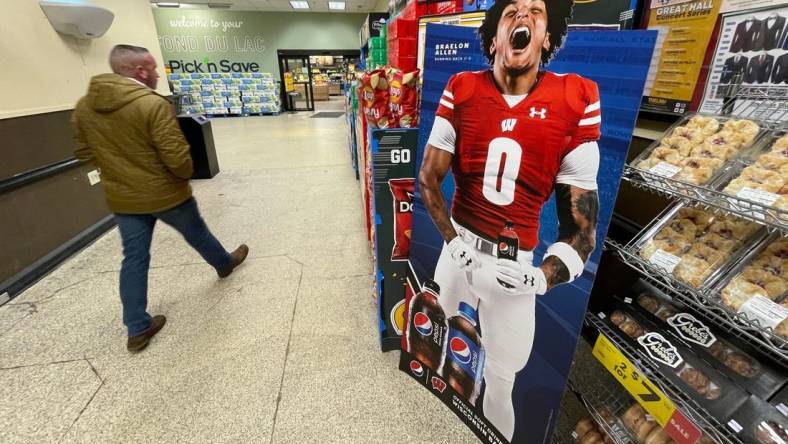 A promotional  display for Pepsi featuring Wisconsin running back Braelon Allen is shown in November 2022 at a Pick 'n Save store in Fond du Lac, Wis. When the NCAA enacted Name Image Likeness (NIL) legislation in July 2021 it gave athletes the opportunity to earn money off endorsements as well as use their name in support of causes important to them.
