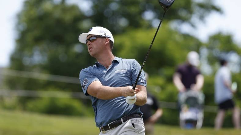 May 27, 2023; Potomac Falls, Virginia, USA; Andy Ogletree hits his tee shot on the second hole during the second round of LIV Golf Washington, D.C. golf tournament at Trump National. Mandatory Credit: Geoff Burke-USA TODAY Sports