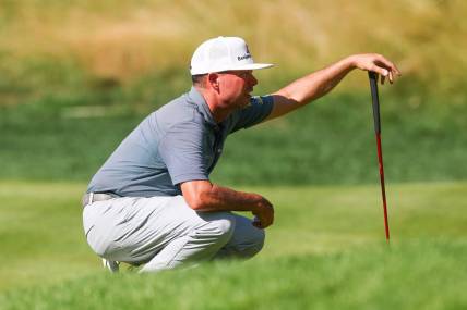 Jun 25, 2023; Cromwell, Connecticut, USA; Chez Reavie reads his putt on the 14th green during the final round of the Travelers Championship golf tournament. Mandatory Credit: Vincent Carchietta-USA TODAY Sports