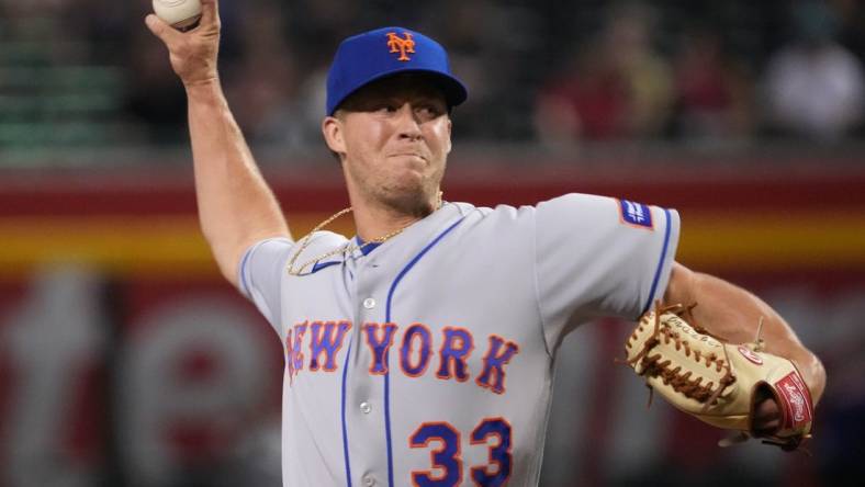 Jul 6, 2023; Phoenix, Arizona, USA; New York Mets relief pitcher Trevor Gott (33) pitches against the Arizona Diamondbacks during the ninth inning at Chase Field. Mandatory Credit: Joe Camporeale-USA TODAY Sports