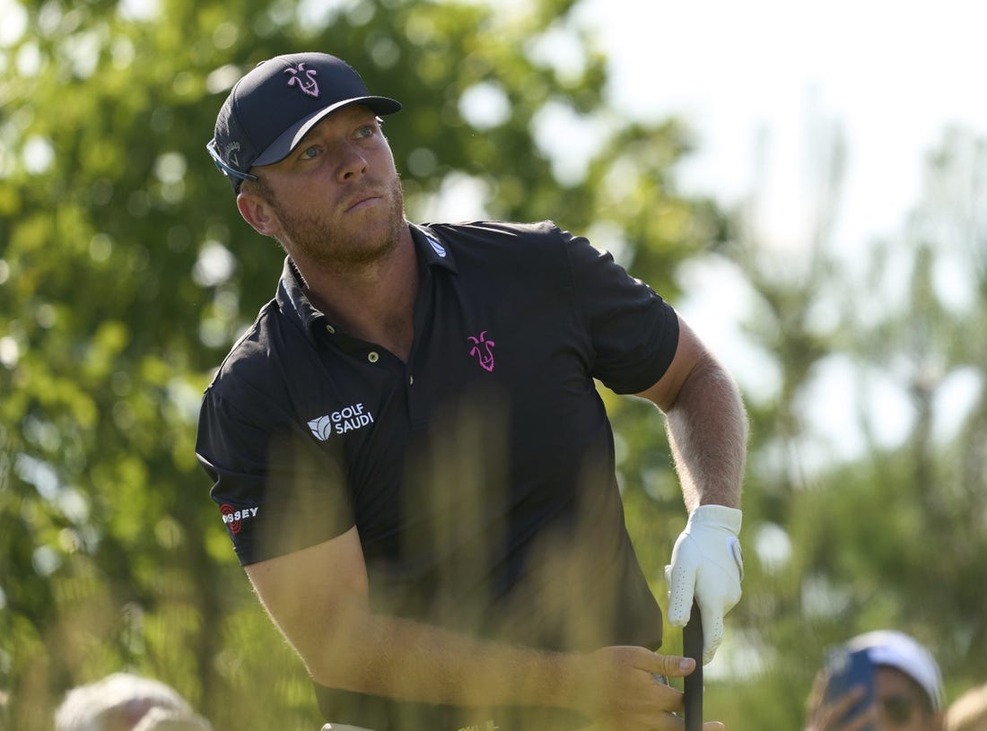 Jul 7, 2023; Hertfordshire, ENG;   Talor Gooch (USA) plays his shot from the fourth tee during the first round of the LIV Golf London golf tournament at Centurion Club. Mandatory Credit: Peter van den Berg-USA TODAY Sports