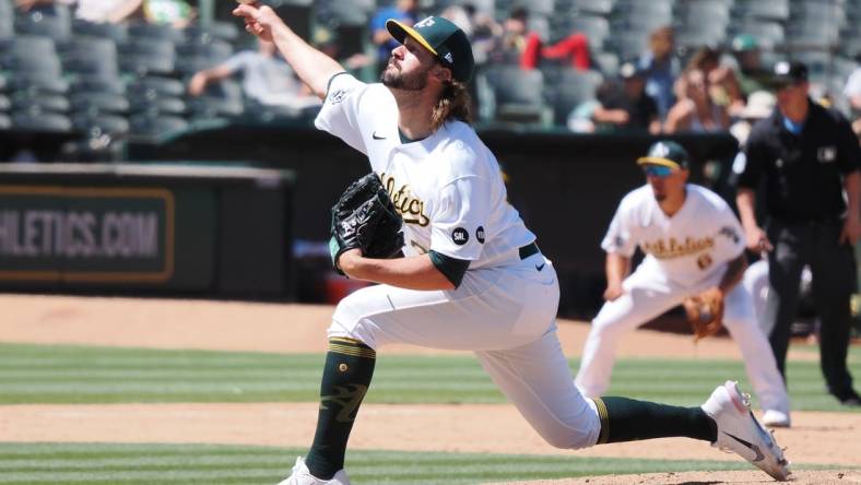 Jul 23, 2023; Oakland, California, USA; Oakland Athletics   relief pitcher Chad Smith (3) pitches the ball against the Houston Astros during the eighth inning at Oakland-Alameda County Coliseum. Mandatory Credit: Kelley L Cox-USA TODAY Sports