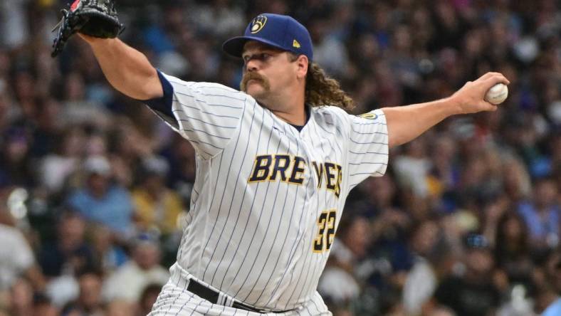 Aug 5, 2023; Milwaukee, Wisconsin, USA;  Milwaukee Brewers pitcher Andrew Chafin (32) pitches against the Pittsburgh Pirates in the eighth inning at American Family Field. Mandatory Credit: Benny Sieu-USA TODAY Sports