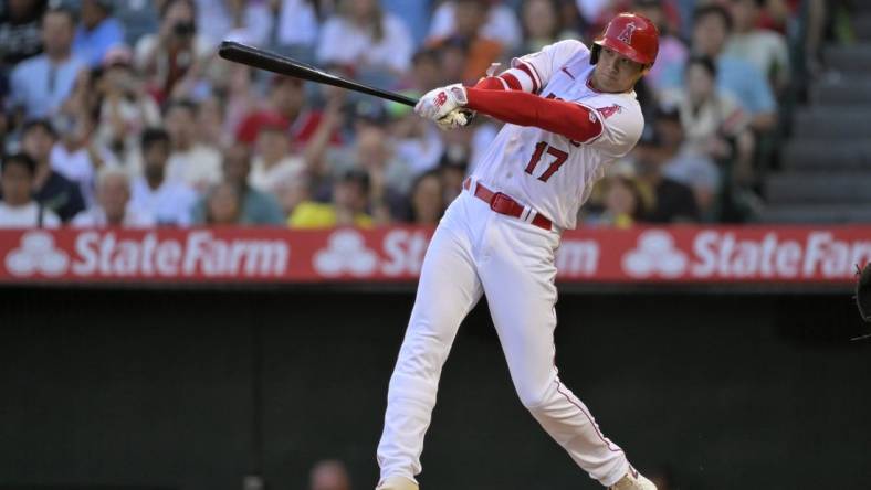 Aug 5, 2023; Anaheim, California, USA; Los Angeles Angels designated hitter Shohei Ohtani (17) lines out to right field in the fourth inning against the Seattle Mariners at Angel Stadium. Mandatory Credit: Jayne Kamin-Oncea-USA TODAY Sports