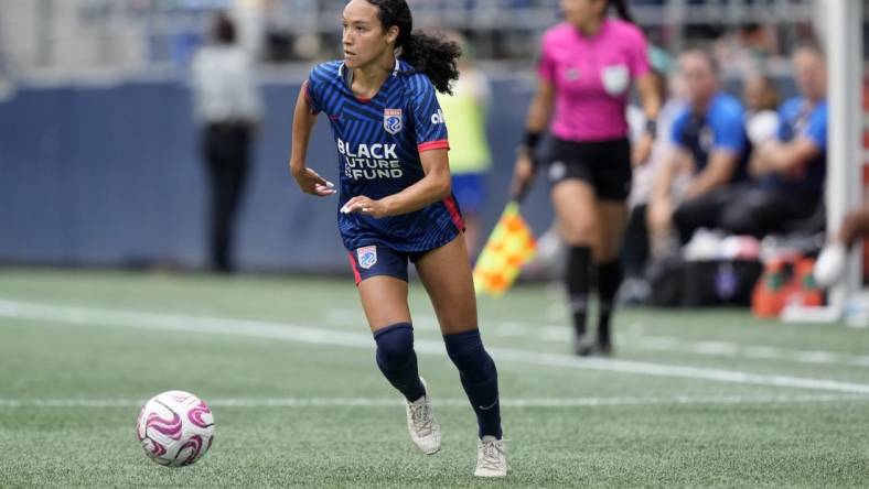 Aug 6, 2023; Seattle, WA, USA; OL Reign defender Alyssa Malonson (20) controls the ball during the second half against Portland Thorns FC  at Lumen Field. Mandatory Credit: Stephen Brashear-USA TODAY Sports