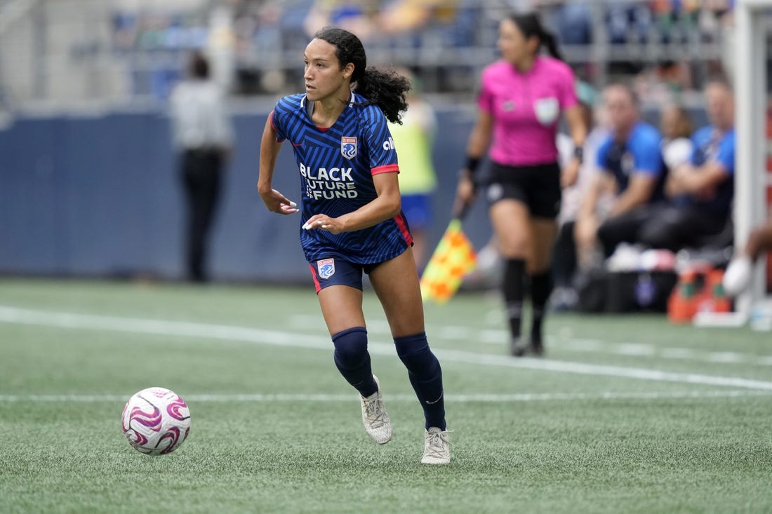 Aug 6, 2023; Seattle, WA, USA; OL Reign defender Alyssa Malonson (20) controls the ball during the second half against Portland Thorns FC  at Lumen Field. Mandatory Credit: Stephen Brashear-USA TODAY Sports