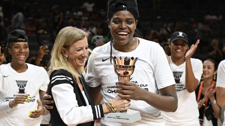Aug 15, 2023; Las Vegas, Nevada, USA; WNBA Commissioner Cathy Engelbert hands New York Liberty forward Jonquel Jones the MVP trophy for the Commissioner   s Cup Championship game after defeating the Las Vegas Aces at Michelob Ultra Arena. Mandatory Credit: Candice Ward-USA TODAY Sports