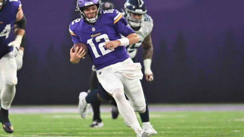 Minnesota Vikings quarterback Nick Mullens (12) runs with the ball against the Tennessee Titans during the second quarter at U.S. Bank Stadium. Mandatory Credit: Jeffrey Becker-USA TODAY Sports