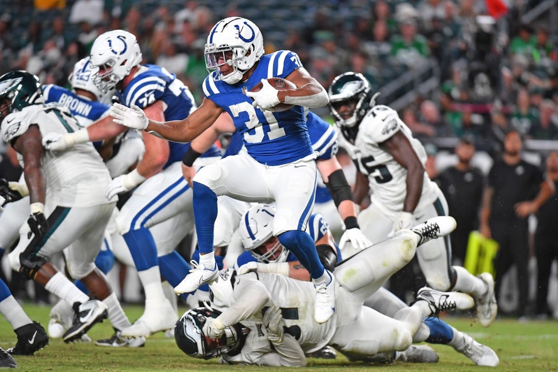 Aug 24, 2023; Philadelphia, Pennsylvania, USA; Indianapolis Colts running back Kenyan Drake (31) leaps over Philadelphia Eagles defensive tackle Caleb Sanders (67) during the fourth quarter at Lincoln Financial Field. Mandatory Credit: Eric Hartline-USA TODAY Sports