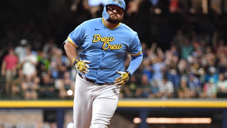 Aug 25, 2023; Milwaukee, Wisconsin, USA; Milwaukee Brewers first baseman Rowdy Tellez (11) rounds the bases after hitting a home run agains the San Diego Padres in the third inning at American Family Field. Mandatory Credit: Michael McLoone-USA TODAY Sports