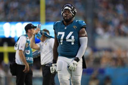 Jacksonville Jaguars offensive tackle Cam Robinson (74) reacts to a catch being confirmed in favor of the Jacksonville Jaguars during the second quarter of a preseason matchup Saturday, Aug. 26, 2023 at EverBank Stadium in Jacksonville, Fla. [Corey Perrine/Florida Times-Union]