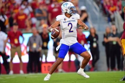 Aug 26, 2023; Los Angeles, California, USA; San Jose State Spartans quarterback Chevan Cordeiro (2) drops back to pass against the Southern California Trojans during the first half at Los Angeles Memorial Coliseum. Mandatory Credit: Gary A. Vasquez-USA TODAY Sports