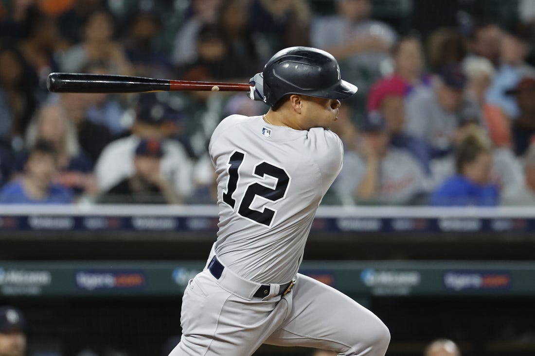 Aug 28, 2023; Detroit, Michigan, USA;  New York Yankees center fielder Isiah Kiner-Falefa (12) hits a single in the eighth inning against the Detroit Tigers at Comerica Park. Mandatory Credit: Rick Osentoski-USA TODAY Sports