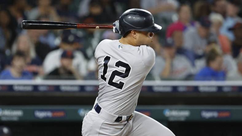 Aug 28, 2023; Detroit, Michigan, USA;  New York Yankees center fielder Isiah Kiner-Falefa (12) hits a single in the eighth inning against the Detroit Tigers at Comerica Park. Mandatory Credit: Rick Osentoski-USA TODAY Sports