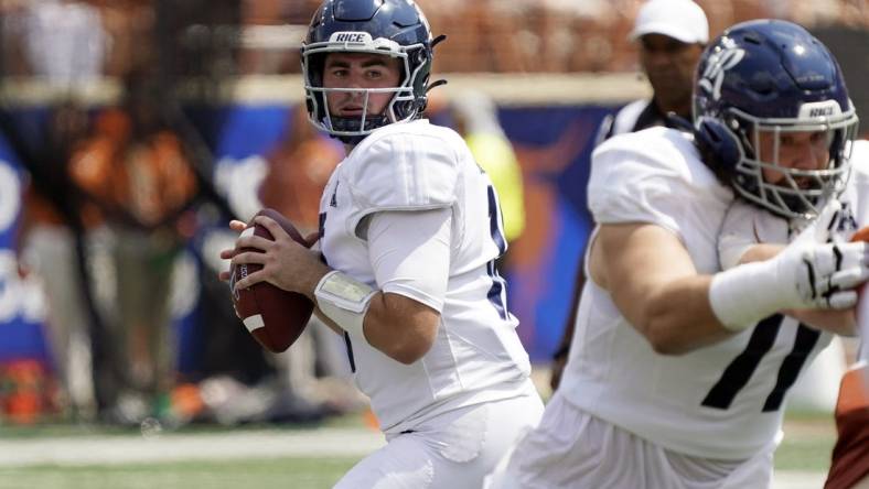 Sep 2, 2023; Austin, Texas, USA; Rice Owls quarterback JT Daniels (18) looks to pass during the first half against the Texas Longhorns at Darrell K Royal-Texas Memorial Stadium. Mandatory Credit: Scott Wachter-USA TODAY Sports