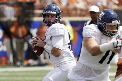Sep 2, 2023; Austin, Texas, USA; Rice Owls quarterback JT Daniels (18) looks to pass during the first half against the Texas Longhorns at Darrell K Royal-Texas Memorial Stadium. Mandatory Credit: Scott Wachter-USA TODAY Sports
