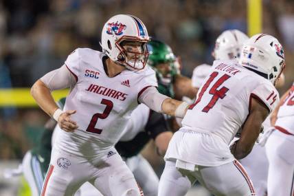 Sep 2, 2023; New Orleans, Louisiana, USA;  South Alabama Jaguars quarterback Carter Bradley (2) hands the ball off to South Alabama Jaguars running back Kentrel Bullock (14) against the Tulane Green Wave during the first half at Yulman Stadium. Mandatory Credit: Stephen Lew-USA TODAY Sports