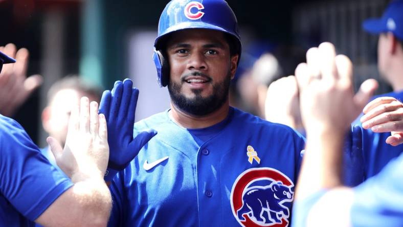 Sep 3, 2023; Cincinnati, Ohio, USA; Chicago Cubs third baseman Jeimer Candelario (9) reacts in the dugout after scoring against the Cincinnati Reds during the eighth inning at Great American Ball Park. Mandatory Credit: David Kohl-USA TODAY Sports