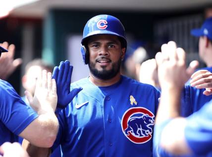 Sep 3, 2023; Cincinnati, Ohio, USA; Chicago Cubs third baseman Jeimer Candelario (9) reacts in the dugout after scoring against the Cincinnati Reds during the eighth inning at Great American Ball Park. Mandatory Credit: David Kohl-USA TODAY Sports