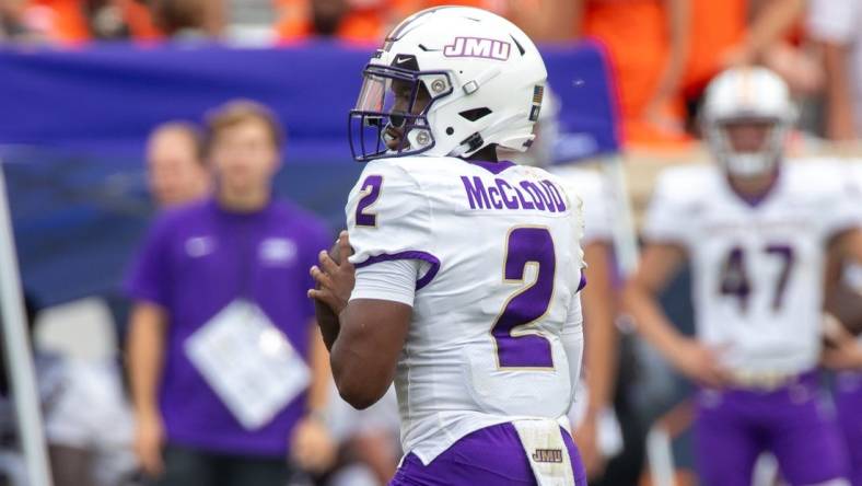 Sept 9, 2023; Charlottesville, Virginia, USA; James Madison Dukes quarterback Jordan McCloud (2) looks for a pass to an open player during the second half of the game against the Virginia Cavaliers at Scott Stadium. Mandatory Credit: Hannah Pajewski-USA TODAY Sports