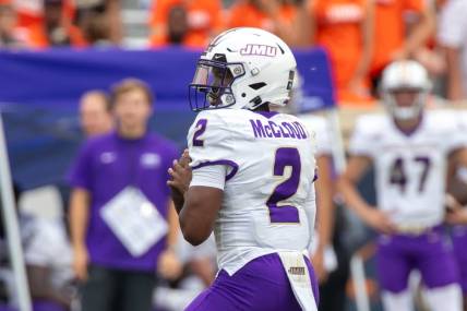 Sept 9, 2023; Charlottesville, Virginia, USA; James Madison Dukes quarterback Jordan McCloud (2) looks for a pass to an open player during the second half of the game against the Virginia Cavaliers at Scott Stadium. Mandatory Credit: Hannah Pajewski-USA TODAY Sports