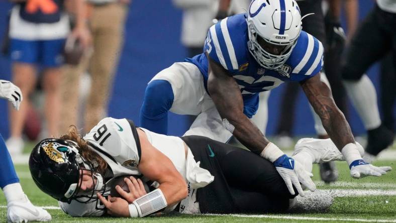 Former Colts linebacker Shaquille Leonard (53) covers Jacksonville Jaguars quarterback Trevor Lawrence (16) as he goes to the turf Sunday, Sept. 10, 2023, during a game against the Jacksonville Jaguars at Lucas Oil Stadium in Indianapolis.