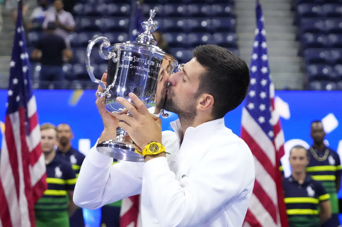 Sep 10, 2023; Flushing, NY, USA; Novak Djokovic of Serbia celebrates with the championship trophy after his match against Daniil Medvedev (not pictured) in the men
