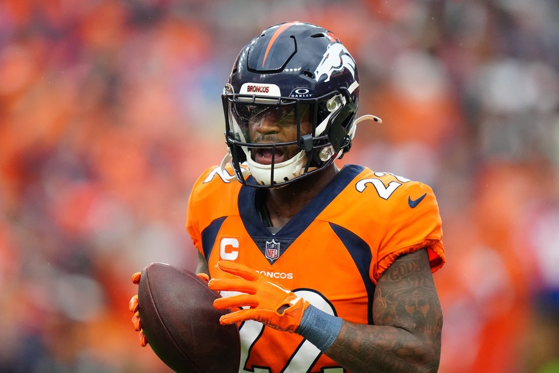 Sep 10, 2023; Denver, Colorado, USA; Denver Broncos safety Kareem Jackson (22) celebrates his turnover in the third quarter against the Las Vegas Raiders at Empower Field at Mile High. Mandatory Credit: Ron Chenoy-USA TODAY Sports