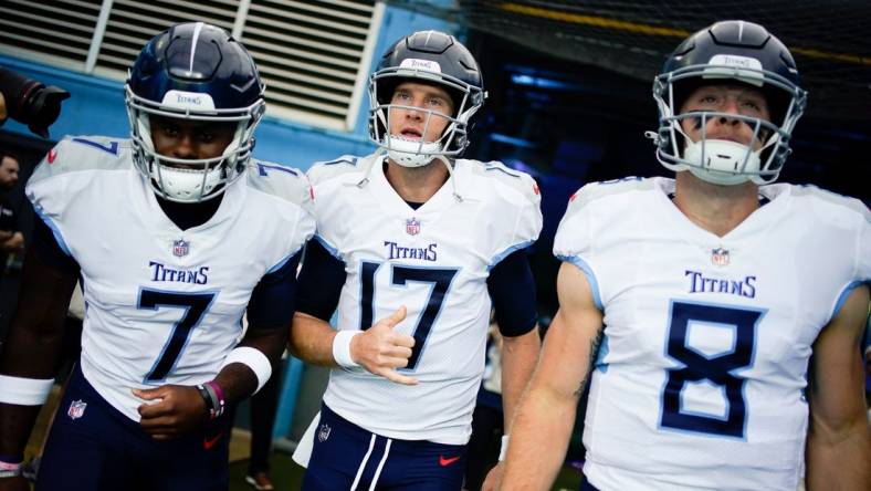 Sep 17, 2023; Nashville, Tennessee, USA; Tennessee Titans quarterbacks Malik Willis (7), Ryan Tannehill (17) and Will Levis (8) head to the field face the Los Angeles Chargers at Nissan Stadium. Mandatory Credit: Andrew Nelles-USA TODAY Sports