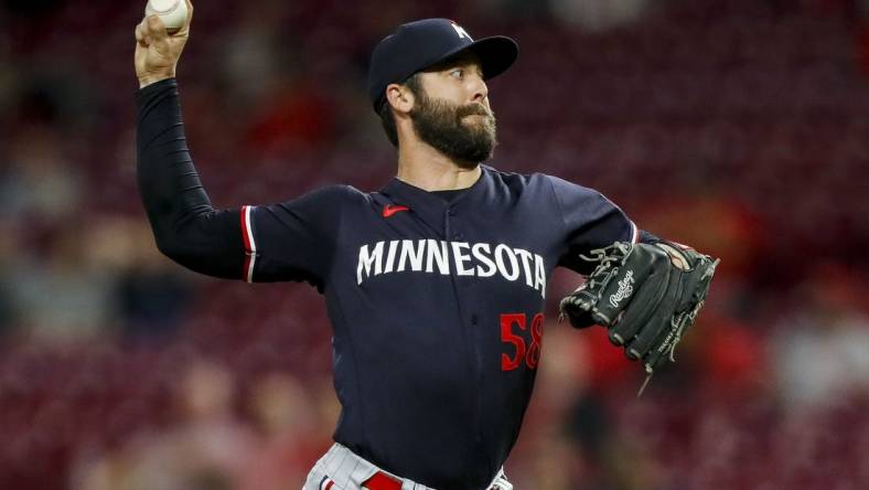 Sep 19, 2023; Cincinnati, Ohio, USA; Minnesota Twins relief pitcher Dylan Floro (58) pitches against the Cincinnati Reds in the ninth inning at Great American Ball Park. Mandatory Credit: Katie Stratman-USA TODAY Sports