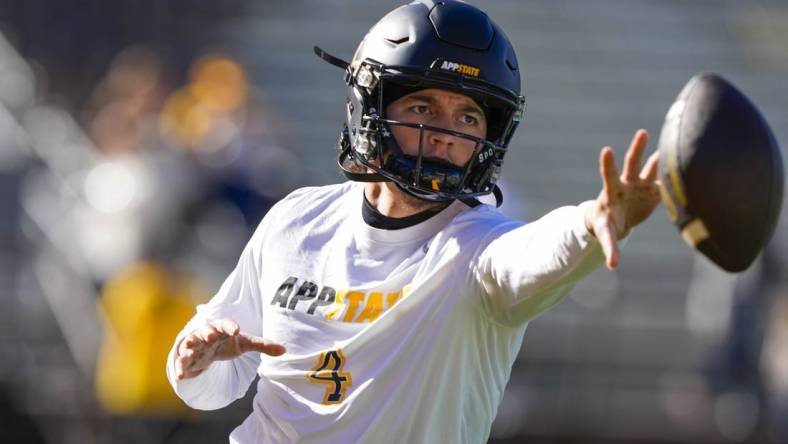 Sep 23, 2023; Laramie, Wyoming, USA; Appalachian State Mountaineers quarterback Joey Aguilar (4) warms up before game against the Wyoming Cowboys at Jonah Field at War Memorial Stadium. Mandatory Credit: Troy Babbitt-USA TODAY Sports