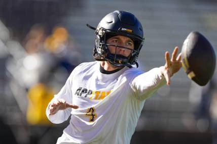 Sep 23, 2023; Laramie, Wyoming, USA; Appalachian State Mountaineers quarterback Joey Aguilar (4) warms up before game against the Wyoming Cowboys at Jonah Field at War Memorial Stadium. Mandatory Credit: Troy Babbitt-USA TODAY Sports