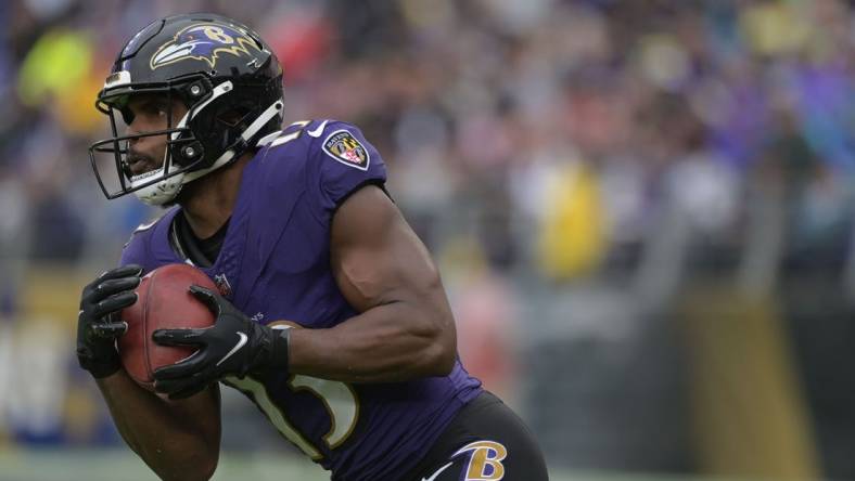 Sep 24, 2023; Baltimore, Maryland, USA; Baltimore Ravens wide receiver Devin Duvernay (13) returns a kick during the game against the Indianapolis Colts at M&T Bank Stadium. Mandatory Credit: Tommy Gilligan-USA TODAY Sports