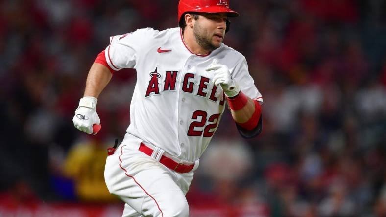 Sep 26, 2023; Anaheim, California, USA; Los Angeles Angels second baseman David Fletcher (22) runs after hitting a single against the Texas Rangers during the fifth inning at Angel Stadium. Mandatory Credit: Gary A. Vasquez-USA TODAY Sports