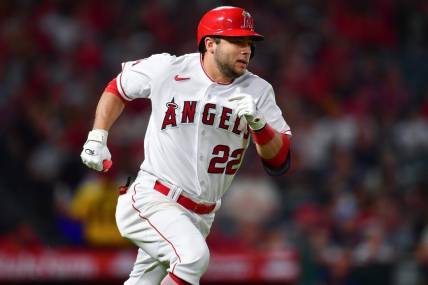 Sep 26, 2023; Anaheim, California, USA; Los Angeles Angels second baseman David Fletcher (22) runs after hitting a single against the Texas Rangers during the fifth inning at Angel Stadium. Mandatory Credit: Gary A. Vasquez-USA TODAY Sports