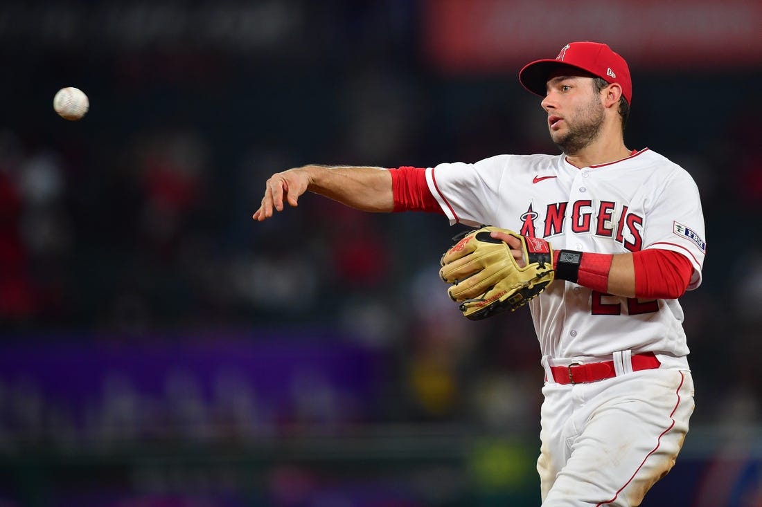 Sep 26, 2023; Anaheim, California, USA; Los Angeles Angels second baseman David Fletcher (22) throws to first for the out against Texas Rangers shortstop Josh Smith (47) during the seventh inning at Angel Stadium. Mandatory Credit: Gary A. Vasquez-USA TODAY Sports