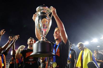 Sep 27, 2023; Fort Lauderdale, FL, USA; Houston Dynamo midfielder Amine Bassi (8) holds up the trophy after winning the Lamar Hunt U.S. Open Cup Final against Inter Miami CF at DRV PNK Stadium. Mandatory Credit: Nathan Ray Seebeck-USA TODAY Sports