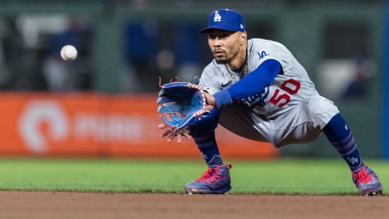 Sep 29, 2023; San Francisco, California, USA; Los Angeles Dodgers second baseman Mookie Betts (50) catches a shallow fly ball for an out against the San Francisco Giants  during the eighth inning at Oracle Park. Mandatory Credit: John Hefti-USA TODAY Sports