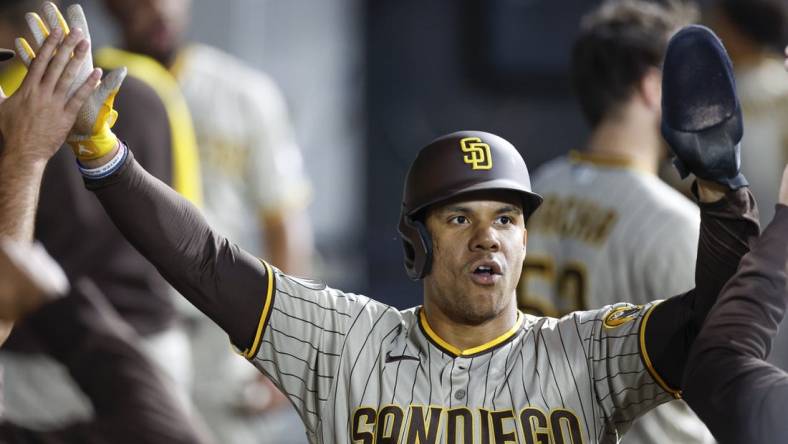 Sep 30, 2023; Chicago, Illinois, USA; San Diego Padres left fielder Juan Soto (22) celebrates with teammates after scoring against the Chicago White Sox during the second inning at Guaranteed Rate Field. Mandatory Credit: Kamil Krzaczynski-USA TODAY Sports