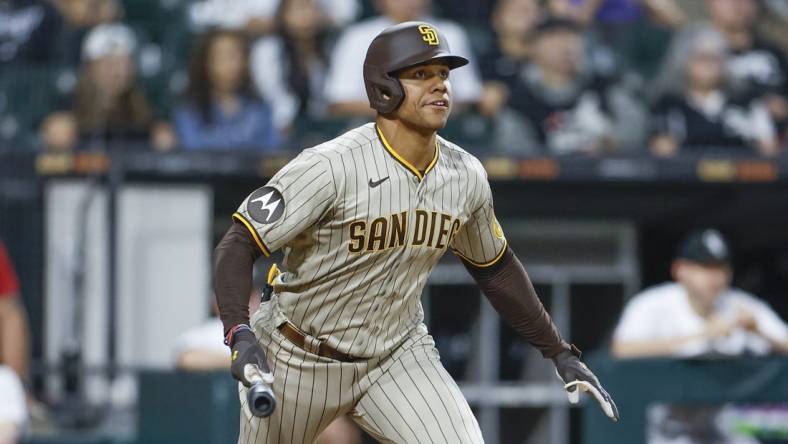 Sep 30, 2023; Chicago, Illinois, USA; San Diego Padres left fielder Juan Soto (22) watches his RBI-double against the Chicago White Sox during the second inning at Guaranteed Rate Field. Mandatory Credit: Kamil Krzaczynski-USA TODAY Sports