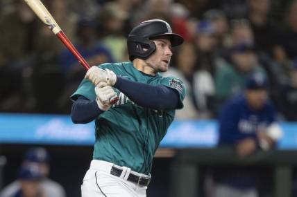 Sep 30, 2023; Seattle, Washington, USA; Seattle Mariners pinch hitter Jarred Kelenic (10) hits a single during the sixth inning against the Texas Rangers at T-Mobile Park. Mandatory Credit: Stephen Brashear-USA TODAY Sports