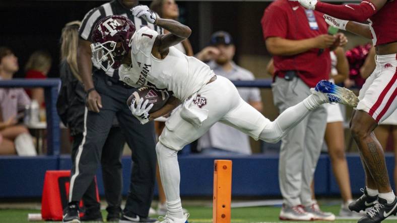 Sep 30, 2023; Arlington, Texas, USA;Texas A&M Aggies wide receiver Evan Stewart (1) scores a touchdown during the game between the Texas A&M Aggies and the Arkansas Razorbacks at AT&T Stadium. Mandatory Credit: Jerome Miron-USA TODAY Sports