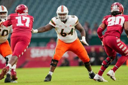 Sep 23, 2023; Philadelphia, Pennsylvania, USA;  Miami Hurricanes offensive lineman Jalen Rivers (64) sets up to block in the second half against the Temple Owls at Lincoln Financial Field. Mandatory Credit: Andy Lewis-USA TODAY Sports