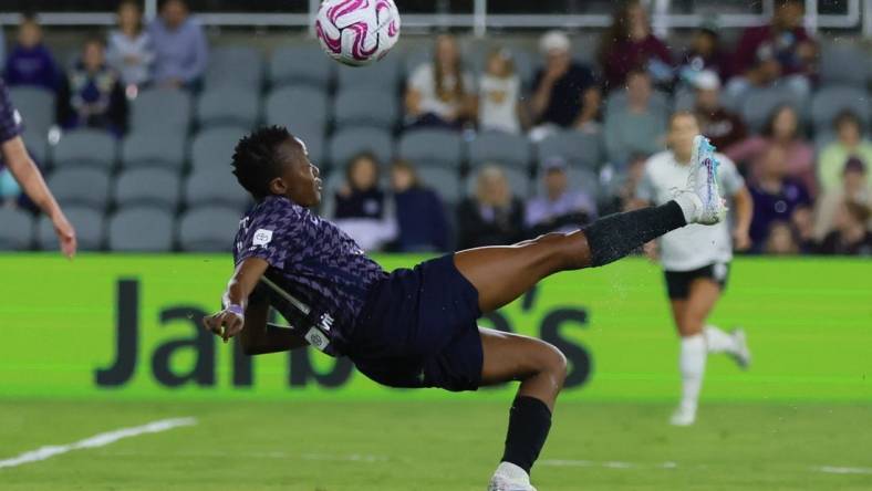 Oct 6, 2023; Louisville, Kentucky, USA; Racing Louisville FC forward Thembi Kgatlana (11) controls the ball in the first half against the Orlando Pride at Lynn Family Stadium. Mandatory Credit: EM Dash-USA TODAY Sports