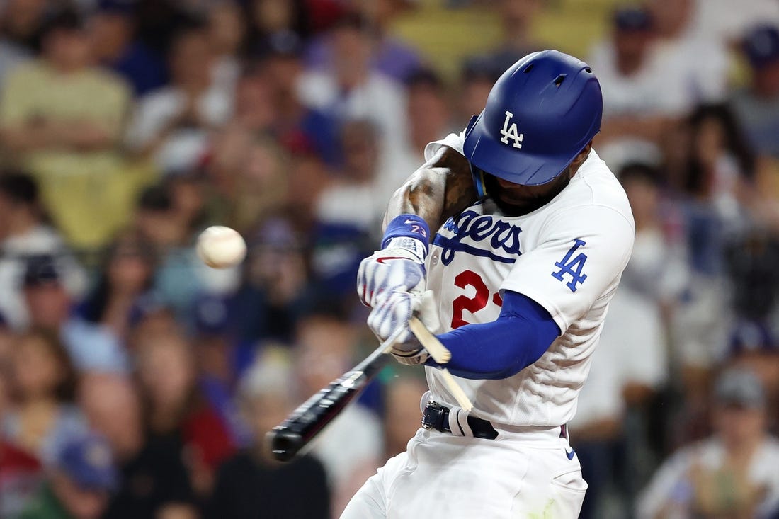 Oct 7, 2023; Los Angeles, California, USA; Los Angeles Dodgers right fielder Jason Heyward (23) breaks a bat on a fly ball against the Arizona Diamondbacks during the second inning for game one of the NLDS for the 2023 MLB playoffs at Dodger Stadium. Mandatory Credit: Kiyoshi Mio-USA TODAY Sports