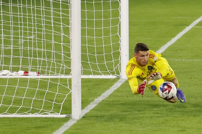 Oct 7, 2023; Washington, District of Columbia, USA; New York City FC goalkeeper Matt Freese (49) dives to make a save against D.C. United in the second half at Audi Field. Mandatory Credit: Geoff Burke-USA TODAY Sports