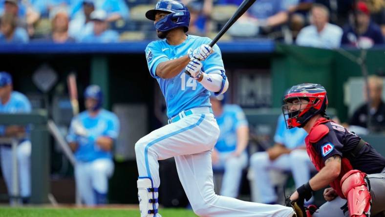 Sep 20, 2023; Kansas City, Missouri, USA; Kansas City Royals left fielder Edward Olivares (14) bats during the third inning against the Cleveland Guardians at Kauffman Stadium. Mandatory Credit: Jay Biggerstaff-USA TODAY Sports