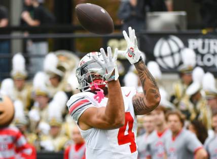 Oct 14, 2023; West Lafayette, Indiana, USA;  Ohio State Buckeyes wide receiver Julian Fleming (4) catches a pass during warmups prior to the game at Ross-Ade Stadium. Mandatory Credit: Robert Goddin-USA TODAY Sports