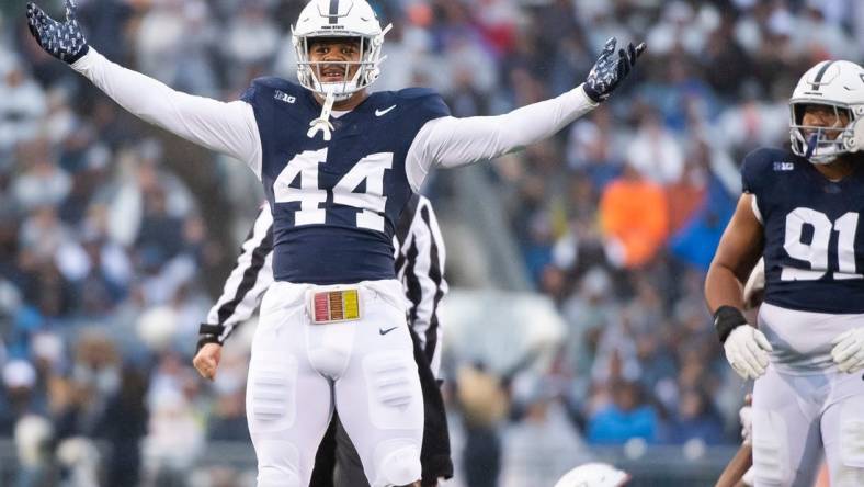 Penn State defensive end Chop Robinson (44) celebrates after sacking Massachusetts quarterback Taisun Phommachanh in the first half of a NCAA football game Saturday, Oct. 14, 2023, in State College, Pa. The Nittany Lions won, 63-0.