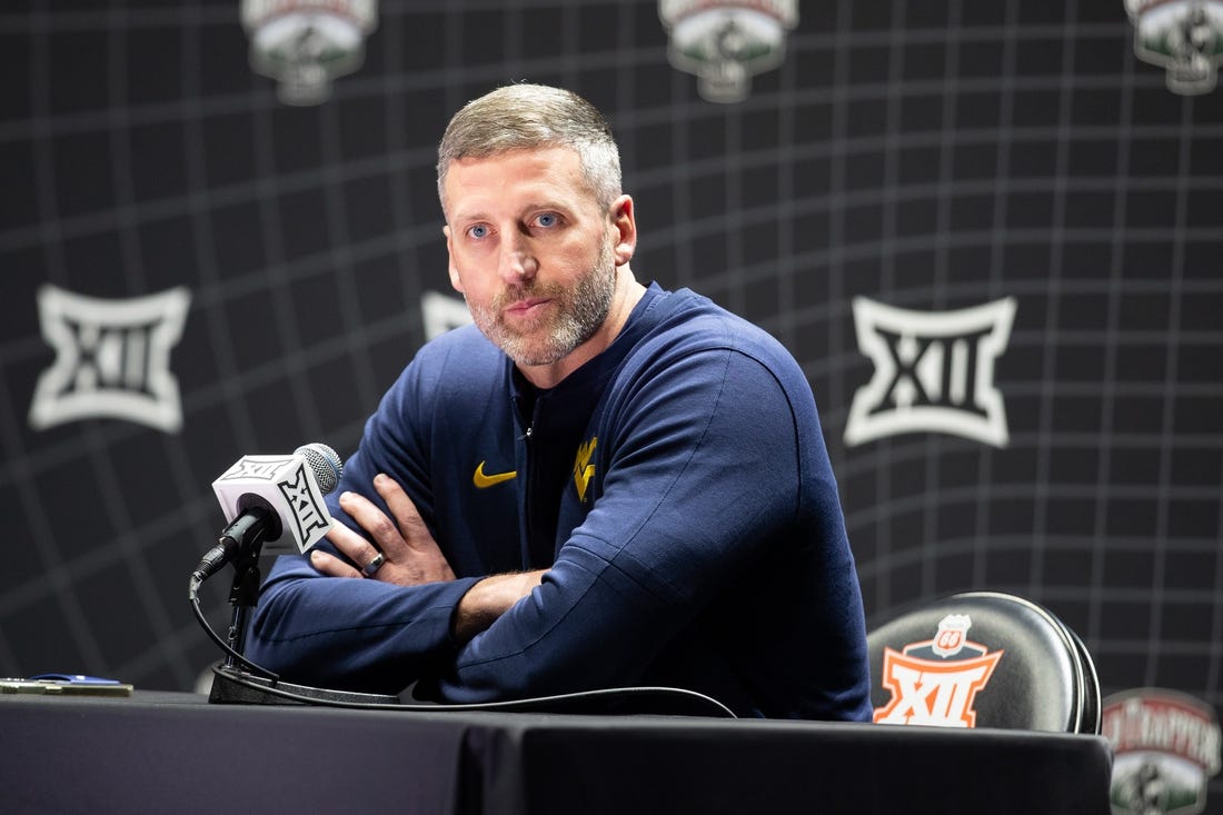 Oct 18, Kansas City, MO, USA; West Virginia interim head coach Josh Eilert answers questions at Big 12 Men s Basketball Tipoff at T-Mobile Center. Mandatory Credit: Kylie Graham-USA TODAY Sports